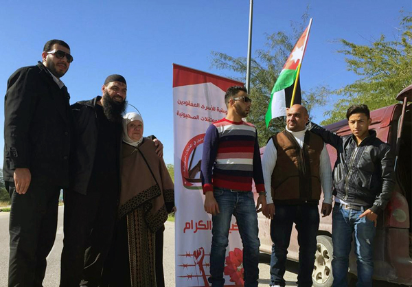 Akram Abu Zahrah (second from left) celebrates his return to Jordan on Thursday with his family near the Jordan Valley Border Crossing (Photo courtesy of Fedaa)